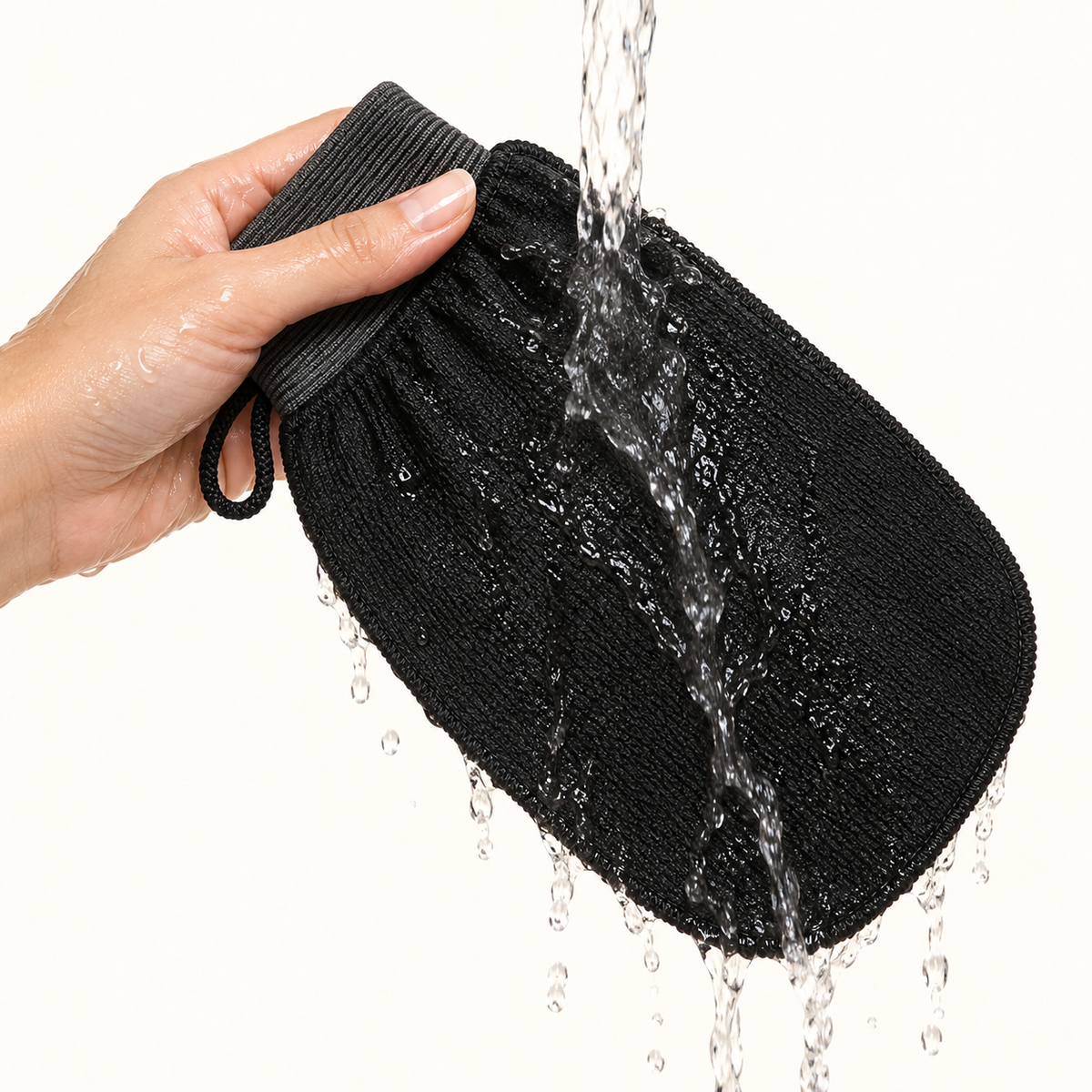 The glove held under running water, no soap