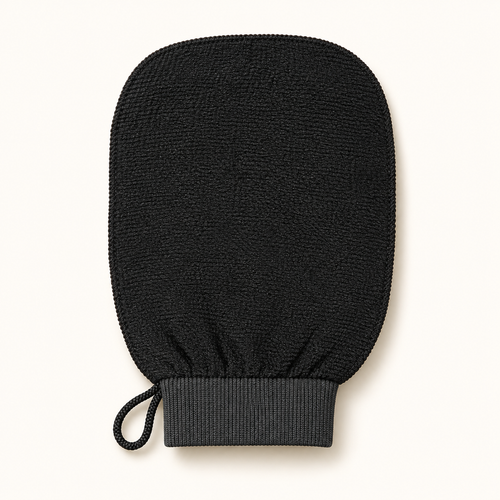 The Sunday Scrub exfoliating glove, front view on a cream background